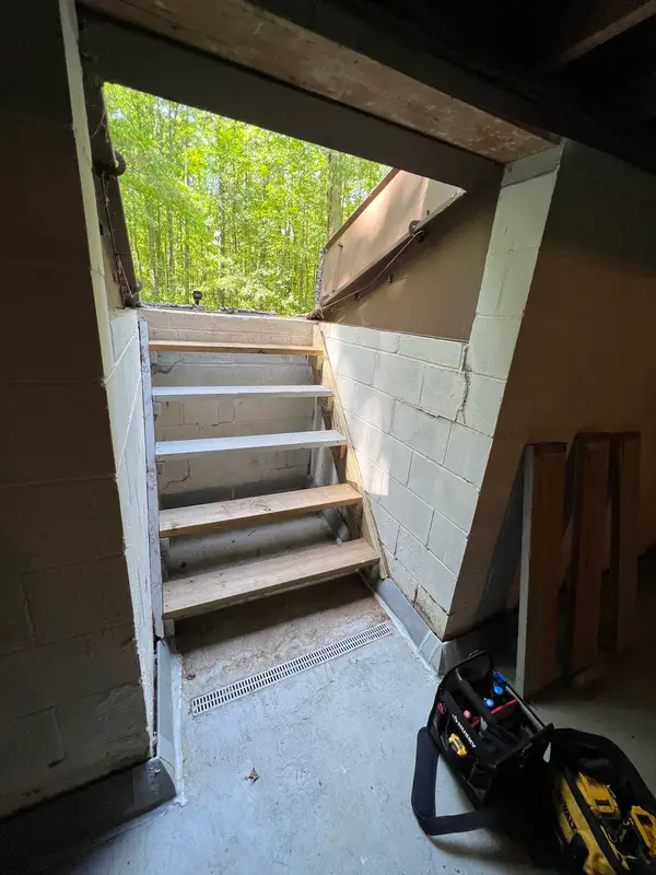 Exterior basement stairwell entry seen from the basement
